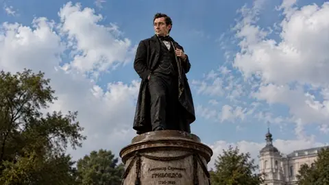is the bronze statue — locked reference for the sculpture's…