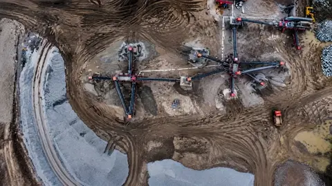 Use this exact aerial top-down photograph as the only…