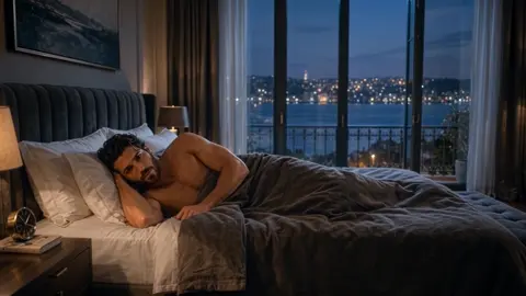 is the opening state: shirtless Kemal lies awake under the…