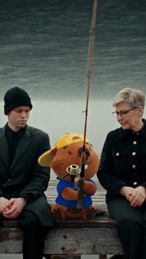 [GOAL] Generate a playful silent scene on the pier: the boy…
